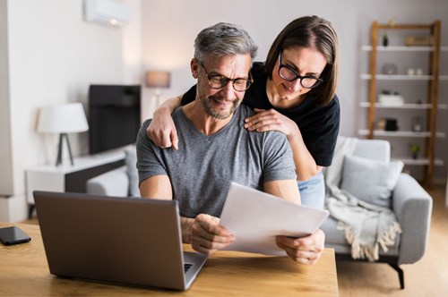 a couple looking a financial documents together