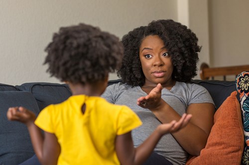 a mother giving her young child instructions