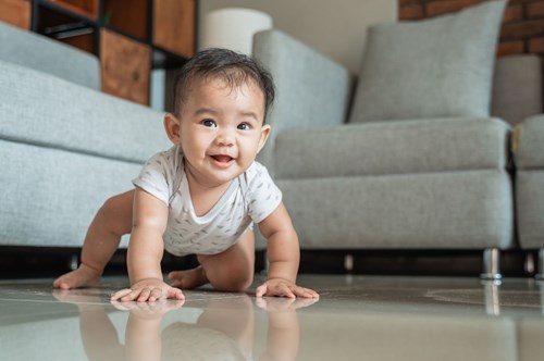 a baby crawling on the floor